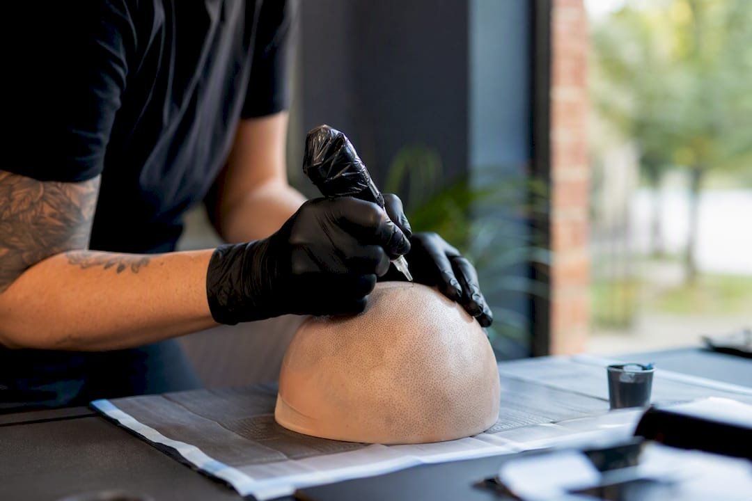 Close-up of SMP student practicing needle technique